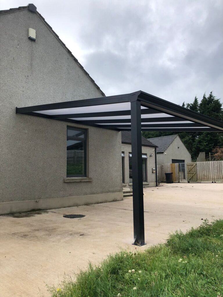 Wall-mounted carport over a driveway