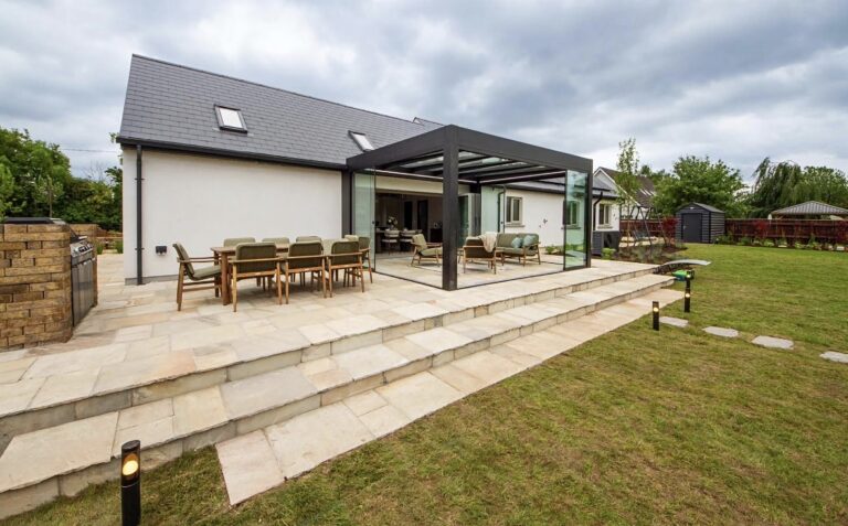 Black glass-roof pergola fitted by Apex Verandas in Kildare
