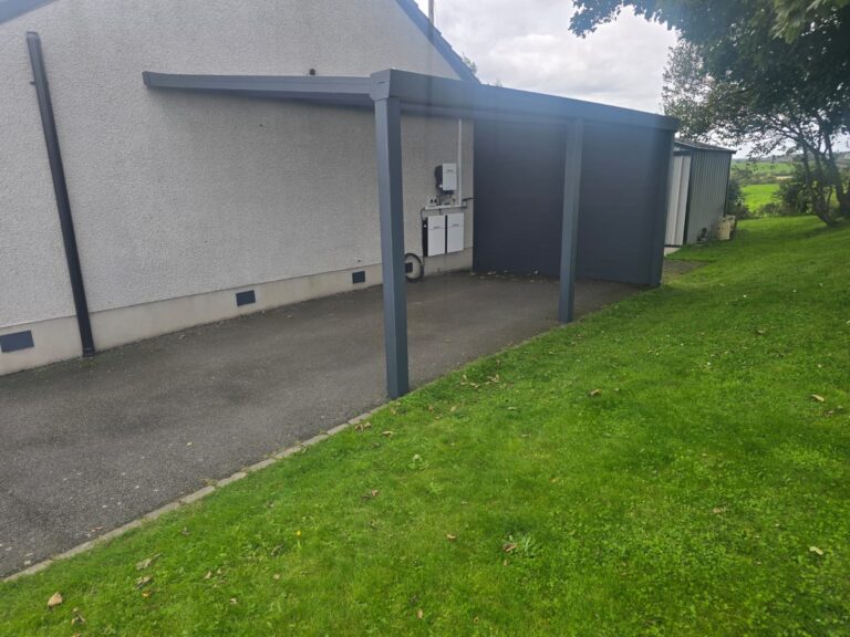 Grey carport along a garage wall